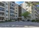 A low angle view of the building's facade shows the entryway, address, and first few stories at 13850 E Marina Dr # 506, Aurora, CO 80014