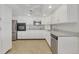 Beautiful, updated kitchen boasts new stainless appliances, a granite countertop, and ample storage space at 13850 E Marina Dr # 506, Aurora, CO 80014