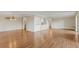Open-concept living room with gleaming wood floors and neutral paint colors, creating a welcoming space at 13850 E Marina Dr # 506, Aurora, CO 80014