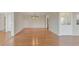 Well-lit living room featuring beautiful hardwood flooring, an elegant chandelier, and freshly painted walls at 13850 E Marina Dr # 506, Aurora, CO 80014