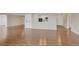 Open-concept living space with hardwood floors, access to kitchen, and large windows at 13850 E Marina Dr # 506, Aurora, CO 80014