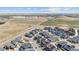 Expansive aerial view of a residential area with a lake and open land, offering a serene setting at 6364 Fulton St, Denver, CO 80238