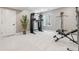 Spacious basement gym with neutral walls, plush carpet, and state of the art workout machines at 6364 Fulton St, Denver, CO 80238