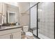 Contemporary bathroom featuring a modern vanity and a glass enclosed shower with a rainfall shower head at 6364 Fulton St, Denver, CO 80238