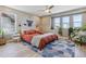 Serene bedroom with hardwood floors, ceiling fan, natural light, and modern decor at 6364 Fulton St, Denver, CO 80238