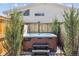 Private hot tub surrounded by lush greenery, ideal for relaxation and outdoor enjoyment at 6364 Fulton St, Denver, CO 80238