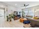 Bright living room with large windows, modern furnishings, and hardwood floors at 6364 Fulton St, Denver, CO 80238