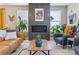 Living area showcasing a sleek fireplace design, comfortable furniture, and natural light at 6364 Fulton St, Denver, CO 80238