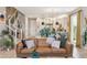 Spacious living area with hardwood floors, comfortable seating, and an open flow to the kitchen and dining at 6364 Fulton St, Denver, CO 80238