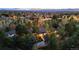 Expansive home surrounded by mature trees with great curb appeal and a long driveway at 1 Greenridge Rd, Greenwood Village, CO 80111