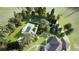 Expansive backyard featuring a sparkling pool, tennis court, and lush landscaping at 1 Greenridge Rd, Greenwood Village, CO 80111