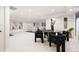 Finished basement offers ample space for entertaining, complete with a round table and stylish seating at 1 Greenridge Rd, Greenwood Village, CO 80111