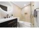 Modern bathroom with glass enclosed shower, black fixtures, and stylish tile, blending luxury with functionality at 1 Greenridge Rd, Greenwood Village, CO 80111