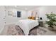 Bedroom featuring decorative rug, large window, and cozy furnishings; creating a calm space at 1 Greenridge Rd, Greenwood Village, CO 80111