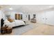 Primary bedroom featuring light colored walls, hardwood flooring, and multiple windows at 1 Greenridge Rd, Greenwood Village, CO 80111