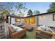 Relaxing deck area with comfortable seating and an open view into the home at 1 Greenridge Rd, Greenwood Village, CO 80111
