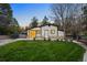 Charming home with well-manicured lawn, complemented by a classic ranch style and inviting curb appeal at dusk at 1 Greenridge Rd, Greenwood Village, CO 80111