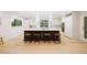 Bright, modern kitchen featuring a large center island with seating and stainless steel appliances at 1 Greenridge Rd, Greenwood Village, CO 80111