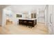 Bright, modern kitchen featuring a large center island with seating and stainless steel appliances at 1 Greenridge Rd, Greenwood Village, CO 80111