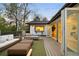 Stylish outdoor deck space with comfortable seating, open kitchen area, and scenic views at 1 Greenridge Rd, Greenwood Village, CO 80111