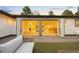 Inviting outdoor living space with seamless flow to the indoors through folding glass doors at 1 Greenridge Rd, Greenwood Village, CO 80111