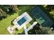 A tennis court and pool create an inviting outdoor experience, blending recreation and relaxation at 1 Greenridge Rd, Greenwood Village, CO 80111
