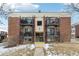 Brick building with balconies and snow at 5995 W Hampden Ave # 5I, Denver, CO 80227