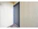 Gray front door to a unit in a multi-unit building at 5995 W Hampden Ave # 5I, Denver, CO 80227