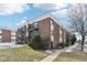 Brick building exterior, with a walkway and landscaping at 5995 W Hampden Ave # 5I, Denver, CO 80227