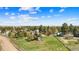 Expansive green lot with a charming home and outbuildings, set in a rural, treed neighborhood at 1151 Buttercup Rd, Elizabeth, CO 80107