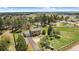 Well-maintained two-story home features a long drive, garage, and fenced yard on a private, treed lot at 1151 Buttercup Rd, Elizabeth, CO 80107