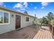 Inviting back deck with outdoor seating, perfect for enjoying a morning coffee or evening sunset at 1151 Buttercup Rd, Elizabeth, CO 80107