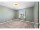 Cozy bedroom featuring neutral carpet and walls with natural light from the window at 1151 Buttercup Rd, Elizabeth, CO 80107