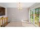 Dining area with tile flooring, chandelier, and sliding door leading to the outside at 1151 Buttercup Rd, Elizabeth, CO 80107