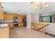 Spacious kitchen with wood cabinets, stainless steel appliances, and tiled floor at 1151 Buttercup Rd, Elizabeth, CO 80107