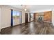 Sunlit living room featuring a rustic fireplace, and laminate wood floors at 1151 Buttercup Rd, Elizabeth, CO 80107