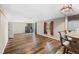Open living room with hardwood floors, natural lighting, and access to outdoor space at 1151 Buttercup Rd, Elizabeth, CO 80107