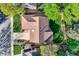 Aerial view of the house, including a well-kept lawn and a brown roof at 2093 S Holland St, Lakewood, CO 80227