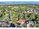 Overhead view of a residential neighborhood near a park, sports fields, and scenic mountains at 2093 S Holland St, Lakewood, CO 80227