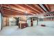 Spacious unfinished basement ready for customization, with storage area and exposed wood beams at 2093 S Holland St, Lakewood, CO 80227
