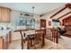Bright dining area showcasing wooden accents, with views into the kitchen and living space at 2093 S Holland St, Lakewood, CO 80227