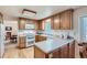 Bright kitchen features wooden cabinets, white appliances, and lots of counter space at 2093 S Holland St, Lakewood, CO 80227