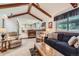Comfortable living room with vaulted ceiling and an open view to the kitchen at 2093 S Holland St, Lakewood, CO 80227