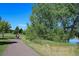 Serene walking path surrounded by lush trees, perfect for outdoor enjoyment at 2093 S Holland St, Lakewood, CO 80227