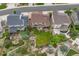 Aerial view of a backyard featuring mature trees, lawn, patio and landscaping at 2575 Mccracken Ln, Castle Rock, CO 80104