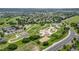 Overhead view of community park featuring tennis courts, playground, and walking paths, surrounded by homes and grassy landscape at 2575 Mccracken Ln, Castle Rock, CO 80104