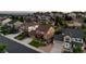 Aerial view of a well-maintained home with a spacious yard in a residential neighborhood, complemented by lush greenery at 2575 Mccracken Ln, Castle Rock, CO 80104