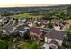 Scenic aerial view showcasing a neighborhood with well-maintained homes, green spaces, and beautiful landscape views at 2575 Mccracken Ln, Castle Rock, CO 80104