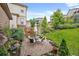Charming backyard with a stone patio and meticulously designed landscaping at 2575 Mccracken Ln, Castle Rock, CO 80104