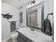 Bathroom featuring modern vanity, framed mirror, and glass-enclosed shower at 2575 Mccracken Ln, Castle Rock, CO 80104